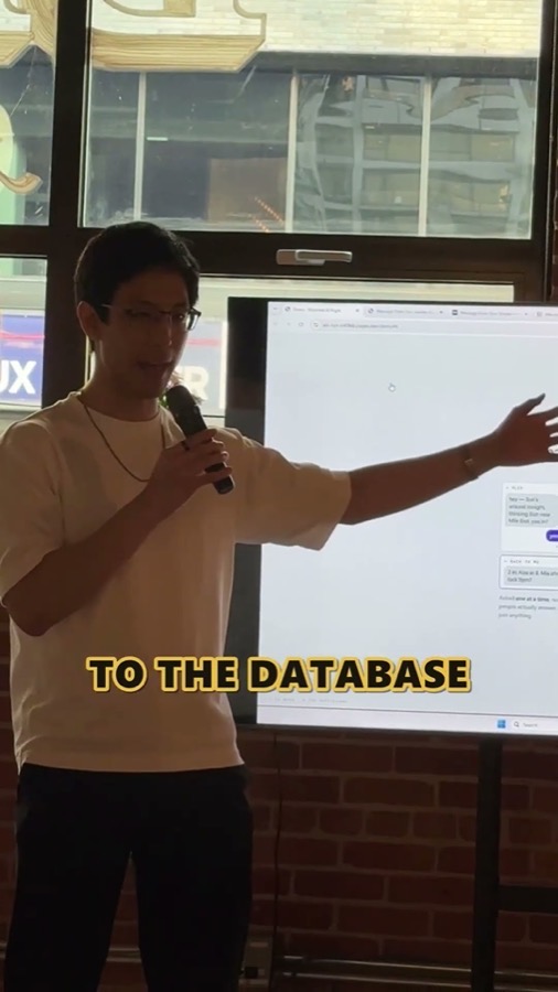 Sunwoong presenting a live agent demo on screen at the workshop.